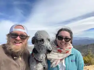 Laura, Bryce and Weir together on a mountain overlook.