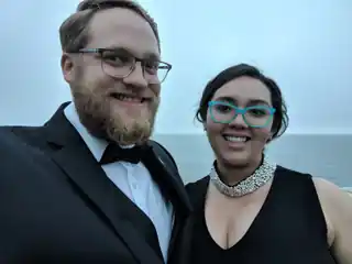 Laura and Bryce dressed for an evening out beside the ocean.