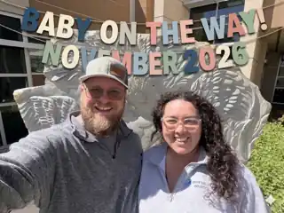 Laura and Bryce beneath a Baby on the Way November 2026 banner.